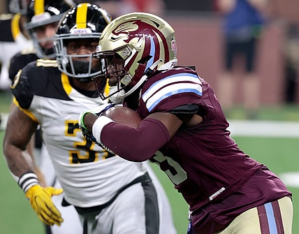 Michigan Panthers wide receiver Ishmael Hyman runs for extra yards as Pittsburgh Maulers defender Kyahva Tezino closes in to stop him during the game at Ford Field in Detroit on Saturday, May 13, 2023. The Maulers beat the Panthers, 23-7.