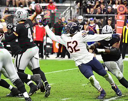Oct 10, 2021; Paradise, Nevada, USA;  Chicago Bears outside linebacker Khalil Mack (52) pressures Las Vegas Raiders quarterback Derek Carr (4) during a game at Allegiant Stadium. Mandatory Credit: Stephen R. Sylvanie-USA TODAY Sports