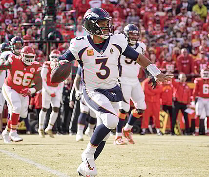 Jan 1, 2023; Kansas City, Missouri, USA; Denver Broncos quarterback Russell Wilson (3) throws a pass against the Kansas City Chiefs during a game at GEHA Field at Arrowhead Stadium. Mandatory Credit: Denny Medley-USA TODAY Sports