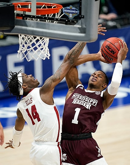 Alabama guard Keon Ellis (14) blocks a shot from Mississippi State guard Iverson Molinar (1) during the first half of the SEC Men's Basketball Tournament game at Bridgestone Arena in Nashville, Tenn., Friday, March 12, 2021.

Ms Ala Sec 031221 An 017