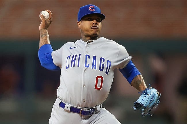 Sep 28, 2023; Atlanta, Georgia, USA; Chicago Cubs starting pitcher Marcus Stroman (0) throws against the Atlanta Braves in the first inning at Truist Park. Mandatory Credit: Brett Davis-USA TODAY Sports