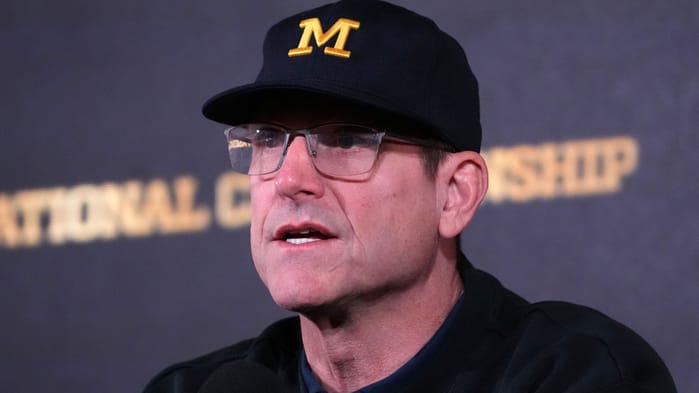 seattle seahawks hire jim harbaugh