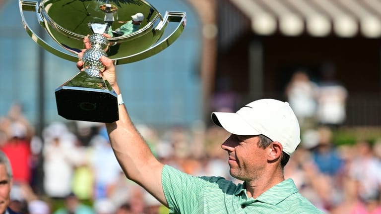 Aug 28, 2022; Atlanta, Georgia, USA; Rory McIlroy holds up the FedEx Cup trophy after winning the TOUR Championship golf tournament. Mandatory Credit: Adam Hagy-USA TODAY Sports