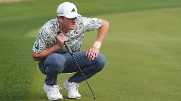 Jan 21, 2024; La Quinta, California, USA; Nick Dunlap lines up a putt on the third green during the final round of The American Express golf tournament at PGA West Stadium Course. Mandatory Credit: Ray Acevedo-USA TODAY Sports