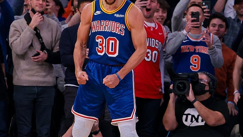 Dec 14, 2021; New York, New York, USA; Golden State Warriors guard Stephen Curry (30) reacts after a three point basket breaking the career record for total three pointers made  during the during the first quarter against the New York Knicks at Madison Square Garden. Mandatory Credit: Vincent Carchietta-USA TODAY Sports