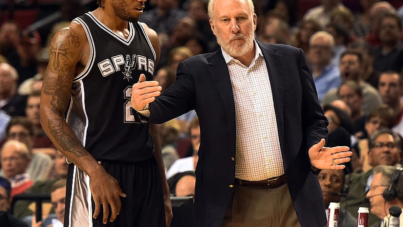 Gregg Popovich talks to Kawhi Leonard