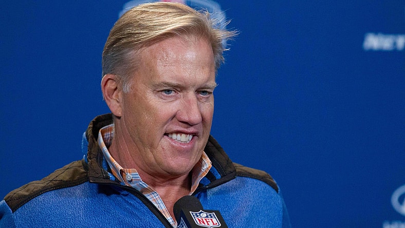 John Elway and the Broncos are looking to move up in the draft