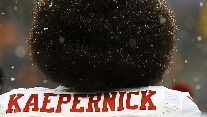 Colin Kaepernick in Chicago as his beautiful hairdo gets snowed upon