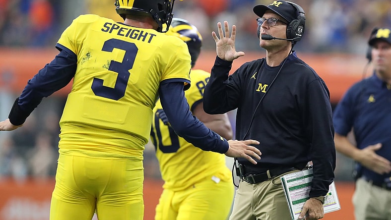 Michigan Quarterback Wilton Speight and head coach Jim Harbaugh