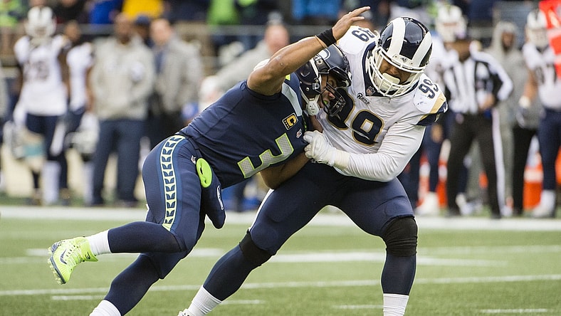 Los Angeles Rams defensive tackle Aaron Donald sacks Settle Seahawks quarterback Russell Wilson