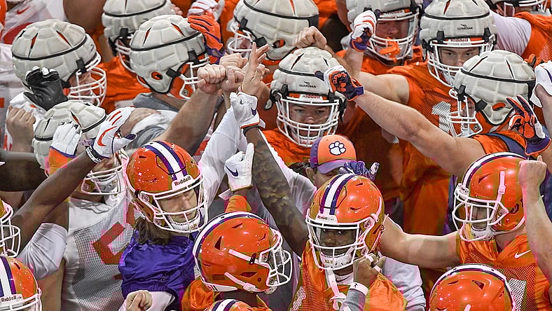 Clemson Tigers football players huddle