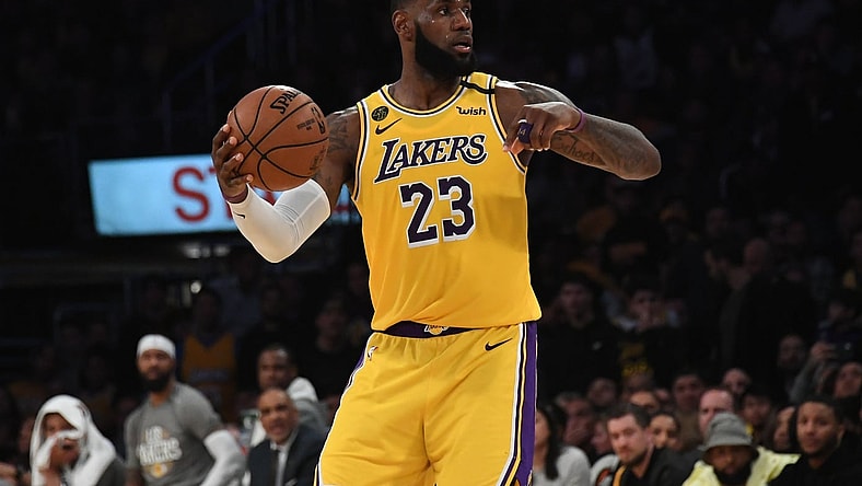 Los Angeles Lakers star LeBron James passes the ball against the Brooklyn Nets.
