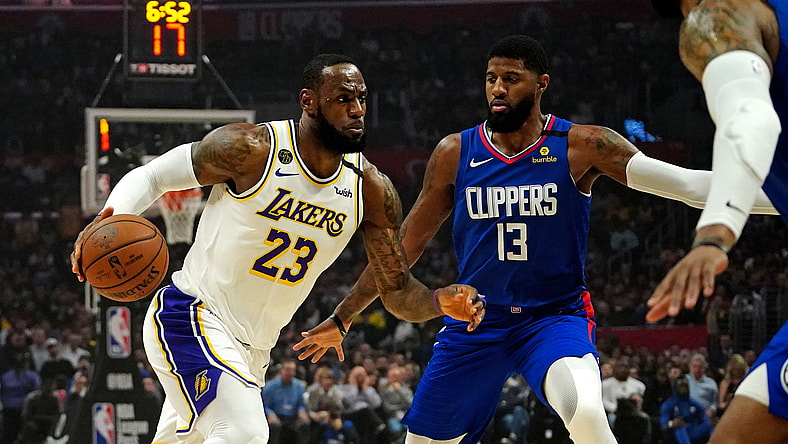 Paul George guards LeBron James
