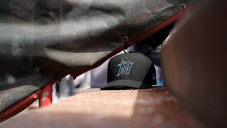 Marlins hat during MLB game against the Reds.