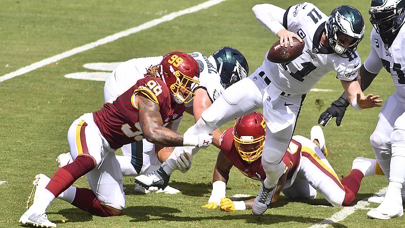 Washington Football Team edge rusher Chase Young hits Philadelphia Eagles QB Carson Wentz in Week 1