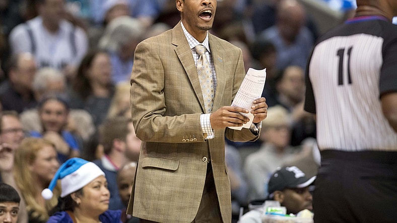 Mavericks' Stephen Silas during NBA game against the Hawks.
