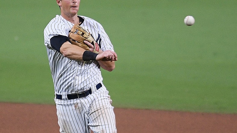 Oct 8, 2020; San Diego, California, USA; New York Yankees second baseman DJ LeMahieu (26) throws to first base to retire Tampa Bay Rays shortstop Willy Adames (not pictured) during the seventh inning of game four of the 2020 ALDS at Petco Park. Mandatory Credit: Orlando Ramirez-USA TODAY Sports