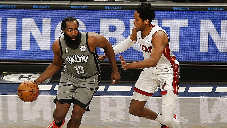 Jan 25, 2021; Brooklyn, New York, USA; Brooklyn Nets guard James Harden (13) dribbles the ball while being defended by Miami Heat forward KZ Okpala (4) during the second half at Barclays Center. Mandatory Credit: Andy Marlin-USA TODAY Sports
