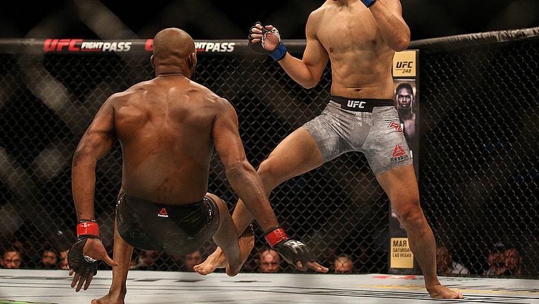 Feb 8, 2020; Houston, Texas, USA;  Jone Jones (red gloves) fights Dominick Reyes (blue gloves) during a UFC championship fight at Toyota Center. Mandatory Credit: Thomas Shea-USA TODAY Sports