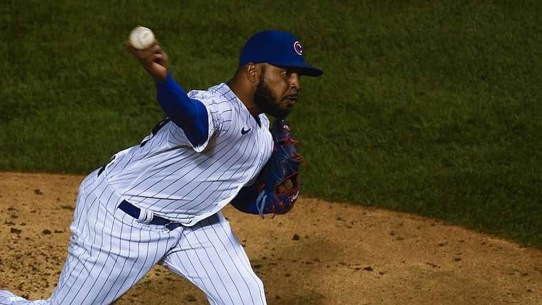 Sep 8, 2020; Chicago, Illinois, USA; Chicago Cubs relief pitcher Jeremy Jeffress (24) delivers in the ninth inning against the Cincinnati Reds at Wrigley Field. Mandatory Credit: Matt Marton-USA TODAY Sports