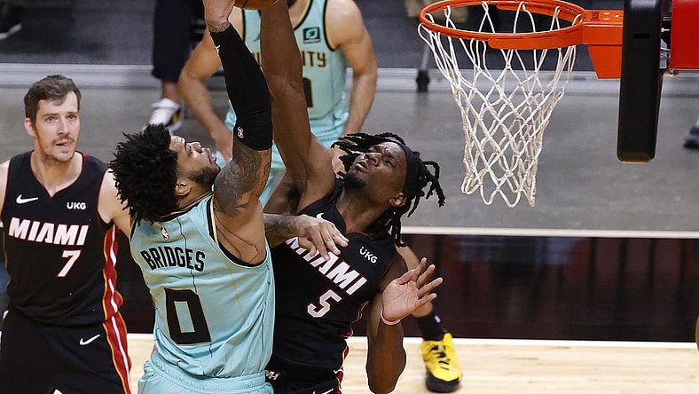 Feb 1, 2021; Miami, Florida, USA;   Miami Heat forward Precious Achiuwa (5) defends Charlotte Hornets forward Miles Bridges (0) during the first half at American Airlines Arena. Mandatory Credit: Rhona Wise-USA TODAY Sports