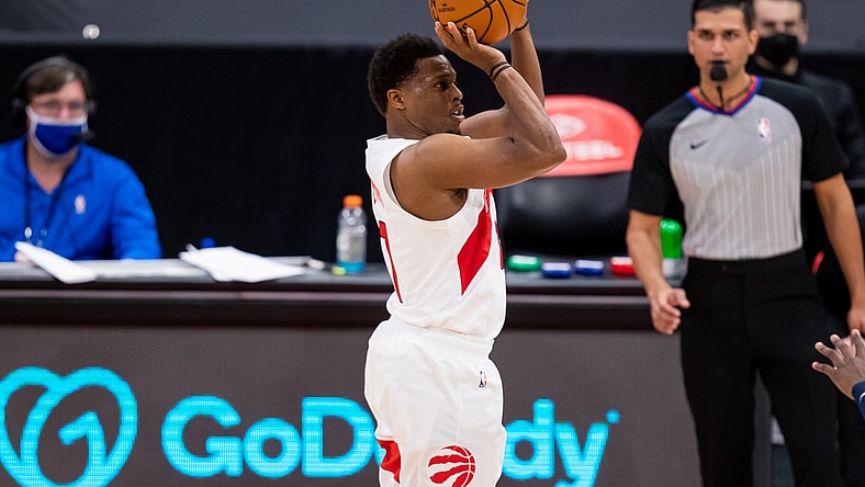 Feb 14, 2021; Tampa, Florida, USA; Toronto Raptors guard Kyle Lowry (7) attempts a three-point shot during the fourth quarter of a game between the Toronto Raptors and the Minnesota Timberwolves at Amalie Arena. Mandatory Credit: Mary Holt-USA TODAY Sports