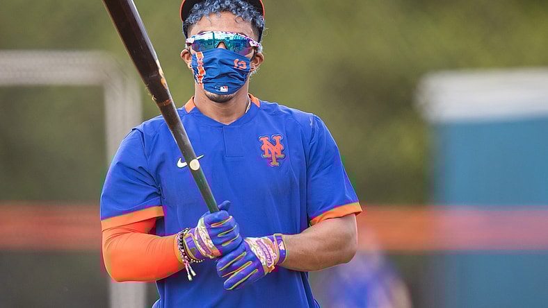 Feb 22, 2021; Port St. Lucie, Florida, USA; New York Mets shortstop Francisco Lindor (12) takes batting practice during the first day of full-squad spring training workouts at Clover Park. Mandatory Credit: Mary Holt-USA TODAY Sports