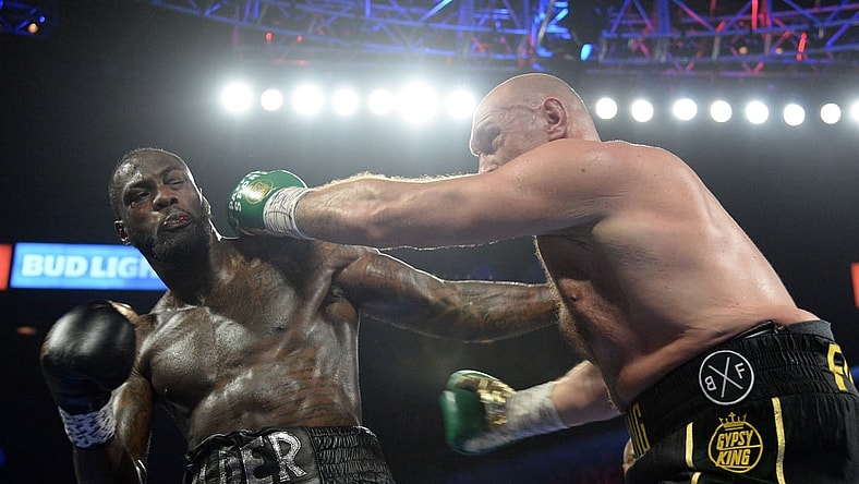 Feb 22, 2020; Las Vegas, Nevada, USA; Deontay Wilder and Tyson Fury box during their WBC heavyweight title bout at MGM Grand Garden Arena. Fury won via seventh round TKO. Mandatory Credit: Joe Camporeale-USA TODAY Sports