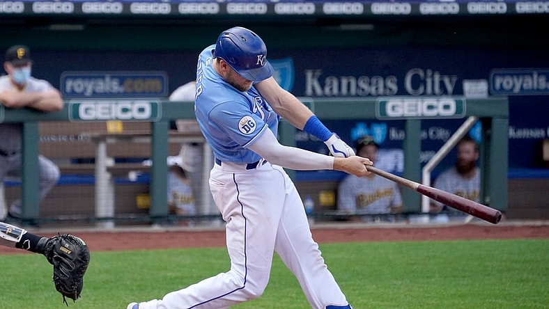 Sep 13, 2020; Kansas City, Missouri, USA; Kansas City Royals first baseman Hunter Dozier (17) connects for a solo home run in the sixth inning against the Pittsburgh Pirates at Kauffman Stadium. Mandatory Credit: Denny Medley-USA TODAY Sports