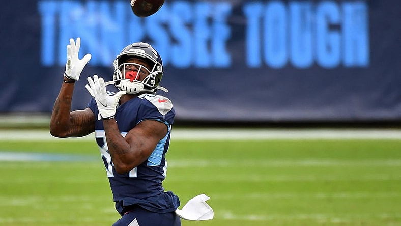 Dec 20, 2020; Nashville, Tennessee, USA; Tennessee Titans wide receiver Corey Davis (84) catches a 75-yard touchdown pass against the Detroit Lions during the first half at Nissan Stadium. Mandatory Credit: Christopher Hanewinckel-USA TODAY Sports