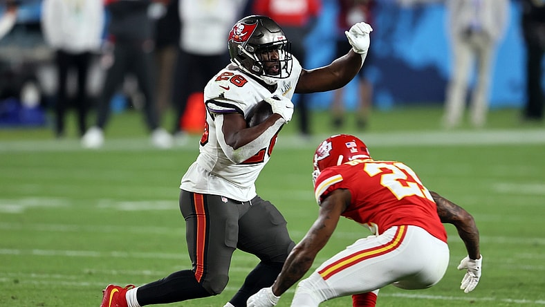 Feb 7, 2021; Tampa, FL, USA;  Tampa Bay Buccaneers running back Leonard Fournette (28) runs the ball against Kansas City Chiefs cornerback Bashaud Breeland (21) during the fourth quarter in Super Bowl LV at Raymond James Stadium.  Mandatory Credit: Matthew Emmons-USA TODAY Sports