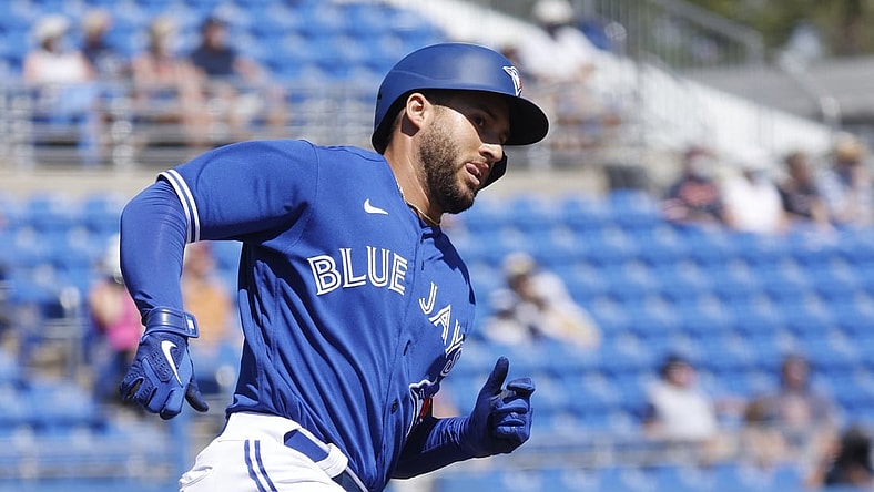 Mar 11, 2021; Dunedin, Florida, USA;  Toronto Blue Jays center fielder George Springer (4) hits a home run during the first inning against the Detroit Tigers during spring training at TD Ballpark. Mandatory Credit: Kim Klement-USA TODAY Sports