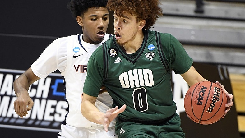 Ohio Bobcats guard Jason Preston (0) looks for a shot guarded by Virginia Cavaliers guard Reece Beekman (2) during the first round of the 2021 NCAA Tournament on Saturday, March 20, 2021, at Simon Skjodt Assembly Hall in Bloomington, Ind. Mandatory Credit: Rich Janzaruk/IndyStar via USA TODAY Sports