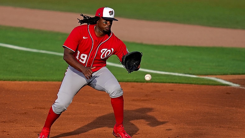 Mar 26, 2021; Port St. Lucie, Florida, USA; Washington Nationals first baseman Josh Bell (19) fields the ground ball before putting out New York Mets center fielder Brandon Nimmo (9, not pictured) in the 1st inning of the spring training game at Clover Park. Mandatory Credit: Jasen Vinlove-USA TODAY Sports