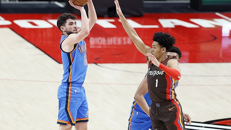 Apr 3, 2021; Portland, Oregon, USA; Oklahoma City Thunder shooting guard Ty Jerome (16) shoots the ball over Portland Trail Blazers shooting guard Anfernee Simons (1) during the first half at Moda Center. Mandatory Credit: Soobum Im-USA TODAY Sports