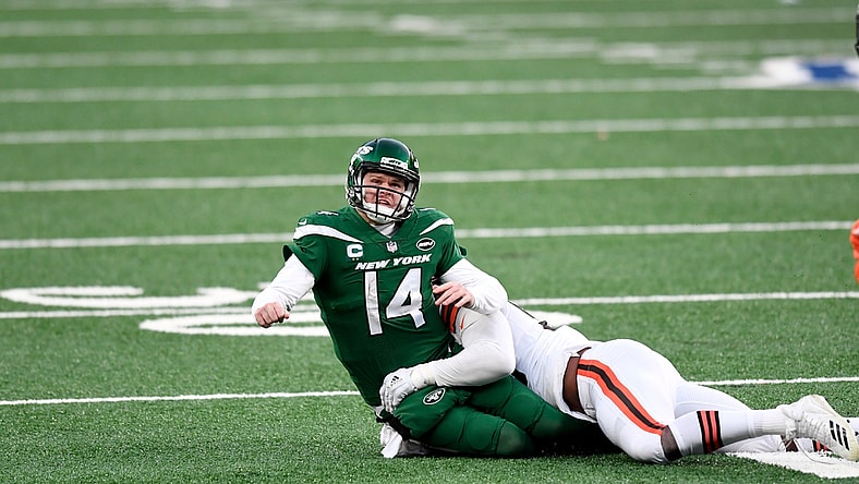 New York Jets quarterback Sam Darnold (14) gets rid of the ball as he's hit by Cleveland Browns defensive tackle Jordan Elliott (90) in the second half. The Jets defeat the Browns, 23-16, at MetLife Stadium on Sunday, Dec. 27, 2020, in East Rutherford.

Nyj Vs Cle