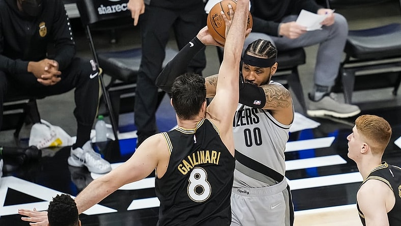 May 3, 2021; Atlanta, Georgia, USA; Portland Trail Blazers forward Carmelo Anthony (00) is defended by Atlanta Hawks forward Danilo Gallinari (8) during the second half at State Farm Arena. Mandatory Credit: Dale Zanine-USA TODAY Sports