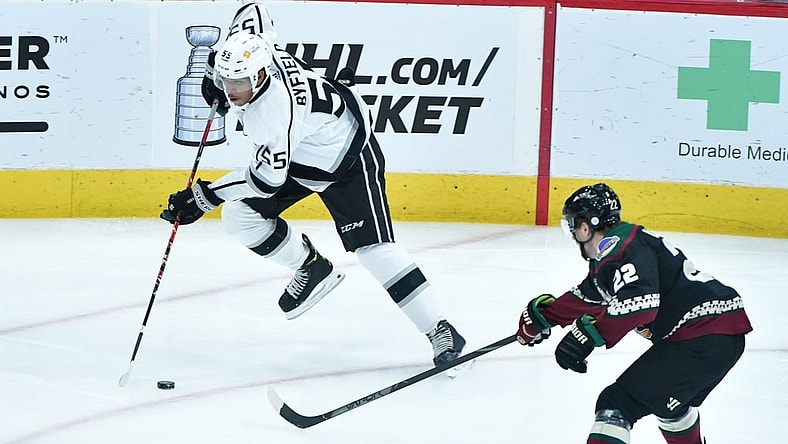 May 3, 2021; Glendale, Arizona, USA; Los Angeles Kings center Quinton Byfield (55) carries the puck as Arizona Coyotes left wing Johan Larsson (22) defends during the first period at Gila River Arena. Mandatory Credit: Matt Kartozian-USA TODAY Sports