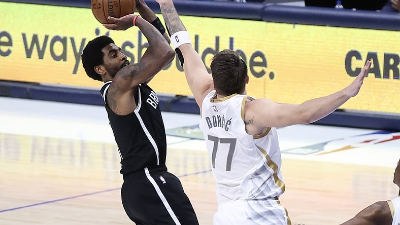 May 6, 2021; Dallas, Texas, USA;  Brooklyn Nets guard Kyrie Irving (11) shoots over Dallas Mavericks guard Luka Doncic (77) during the third quarter at American Airlines Center. Mandatory Credit: Kevin Jairaj-USA TODAY Sports