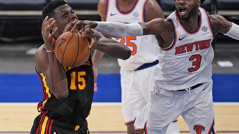 May 23, 2021; New York, New York, USA; New York Knicks center Nerlens Noel (3) fouls Atlanta Hawks center Clint Capela (15) during the second half in game one in the first round of the 2021 NBA Playoffs at Madison Square Garden. Mandatory Credit: Seth Wenig/Pool Photo-USA TODAY Sports