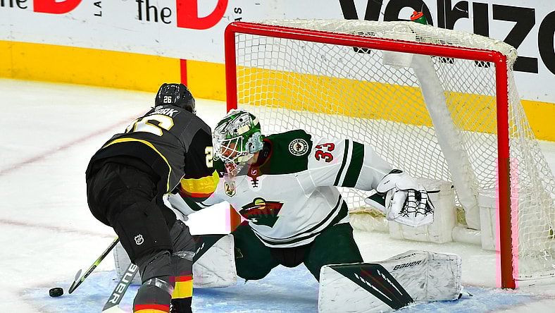 May 28, 2021; Las Vegas, Nevada, USA; Vegas Golden Knights center Mattias Janmark (26) scores a first period goal against Minnesota Wild goaltender Cam Talbot (33) in game seven of the first round of the 2021 Stanley Cup Playoffs at T-Mobile Arena. Mandatory Credit: Stephen R. Sylvanie-USA TODAY Sports