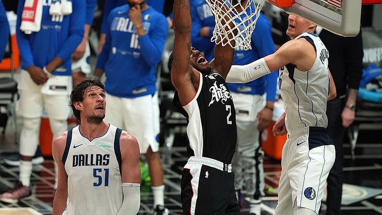 Jun 6, 2021; Los Angeles, California, USA; Los Angeles Clippers forward Kawhi Leonard (2) moves in for a basket against Dallas Mavericks center Kristaps Porzingis (6) and center Boban Marjanovic (51) during the second half in game seven of the first round of the 2021 NBA Playoffs. at Staples Center. Mandatory Credit: Kirby Lee-USA TODAY Sports