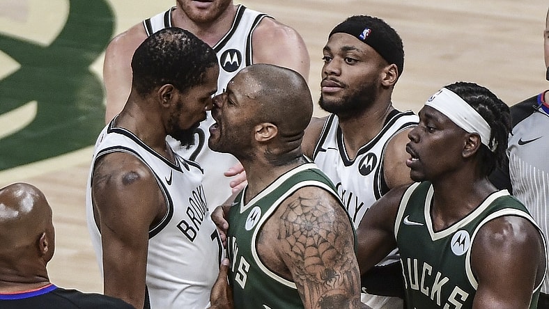 Jun 10, 2021; Milwaukee, Wisconsin, USA; Milwaukee Bucks forward P.J. Tucker (17) yells in the face of Brooklyn Nets forward Kevin Durant (7) in the third quarter during game three in the second round of the 2021 NBA Playoffs at Fiserv Forum. Mandatory Credit: Benny Sieu-USA TODAY Sports