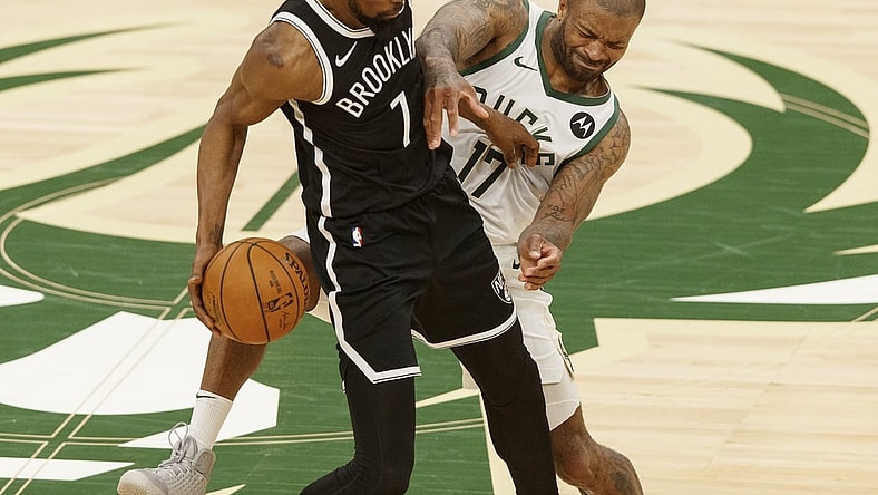 Jun 13, 2021; Milwaukee, Wisconsin, USA;  Milwaukee Bucks forward P.J. Tucker (17) defends Brooklyn Nets forward Kevin Durant (7) during the third quarter during game four in the second round of the 2021 NBA Playoffs. at Fiserv Forum. Mandatory Credit: Jeff Hanisch-USA TODAY Sports