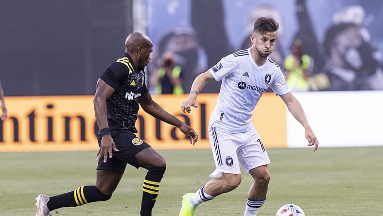 Jun 19, 2021; Columbus, Ohio, USA; Columbus Crew midfielder Darlington Nagbe (6) pressures Chicago Fire midfielder Alvaro Medran (10) during the first half of the final game at Historic Crew Stadium. Mandatory Credit: Greg Bartram-USA TODAY Sports