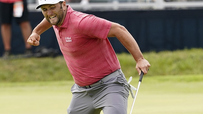 Jun 20, 2021; San Diego, California, USA; Jon Rahm reacts to his birdie putt on the 18th green during the final round of the U.S. Open golf tournament at Torrey Pines Golf Course. Mandatory Credit: Michael Madrid-USA TODAY Sports