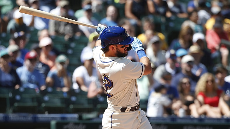 Jul 25, 2021; Seattle, Washington, USA; Seattle Mariners designated hitter Luis Torrens (22) hits an RBI single against the Oakland Athletics during the third inning at T-Mobile Park. Mandatory Credit: Joe Nicholson-USA TODAY Sports