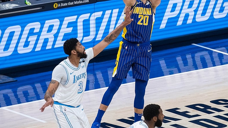 May 15, 2021; Indianapolis, Indiana, USA; Indiana Pacers forward Doug McDermott (20) shoots the ball while Los Angeles Lakers forward Anthony Davis (3) defends in the first quarter at Bankers Life Fieldhouse. Mandatory Credit: Trevor Ruszkowski-USA TODAY Sports