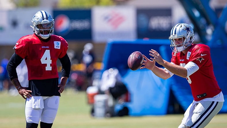 Jul 29, 2021; Oxnard, CA, USA; Dallas Cowboys quarterbacks Dak Prescott (4) and quarterback Garrett Gilbert (3) during training camp at the River Ridge playing fields at the Residence Inn by Marriott in Oxnard, California. Mandatory Credit: Jason Parkhurst-USA TODAY Sports