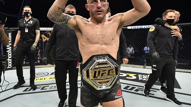 July 12, 2020; Abu Dhabi, UAE;  Alexander Volkanovski of Australia celebrates after his split-decision victory over Max Holloway in their UFC featherweight championship fight during the UFC 251 event at Flash Forum on UFC Fight Island on July 12, 2020 on Yas Island, Abu Dhabi, United Arab Emirates. Mandatory Credit: Jeff Bottari/Zuffa LLC via USA TODAY Sports